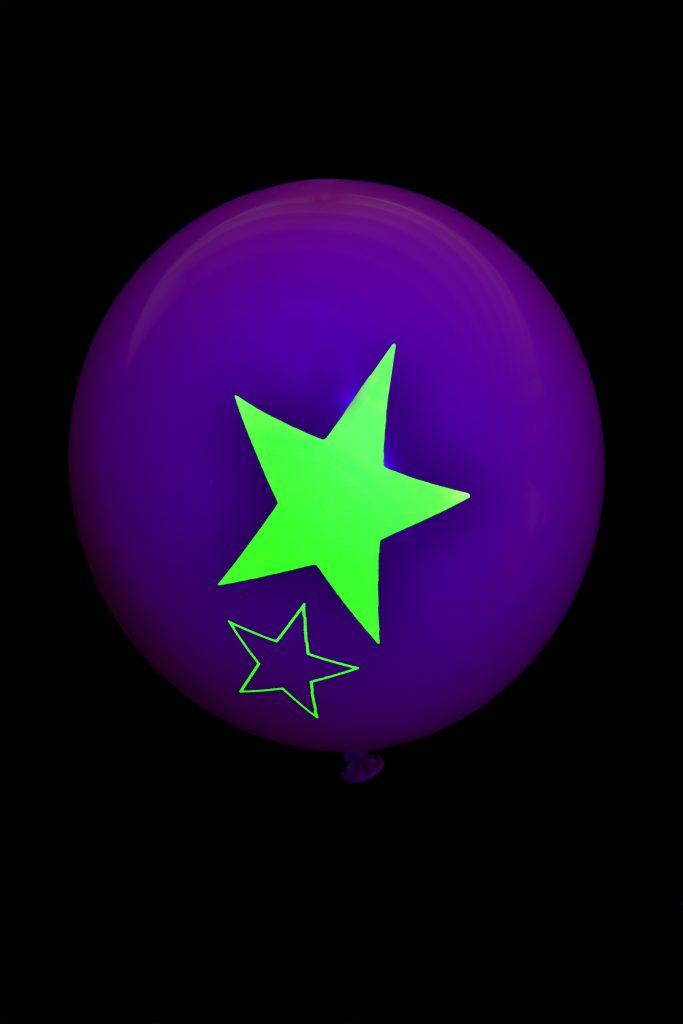 green Fluorescent star print on balloons under UV light